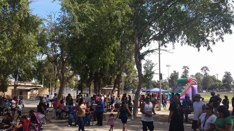Families gathered at an outdoor outreach event