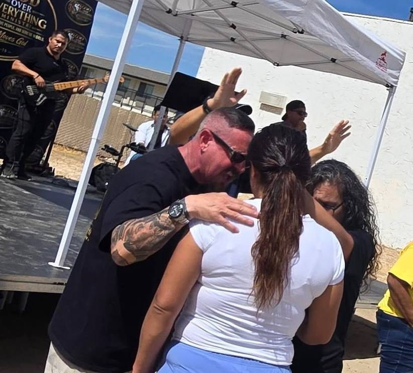People praying together at an outreach